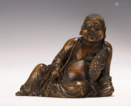 A CARVED HARDWOOD FIGURAL DECORATION