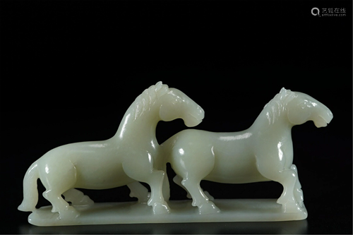 A JADE CARVING OF TWO HORSES