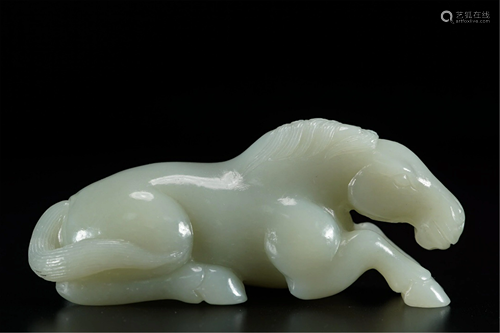 A WHITE JADE CARVING OF HORSE