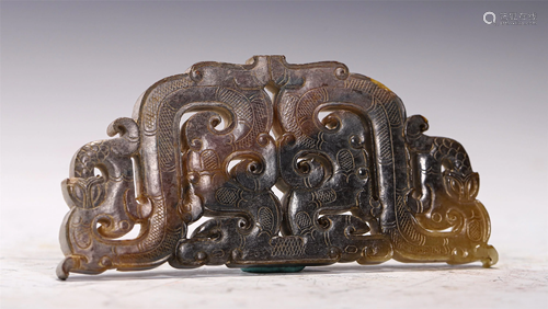 A HOLLOW CARVED JADE BI