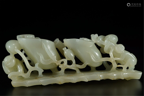 A JADE CARVED DECORATION OF MONKEYS