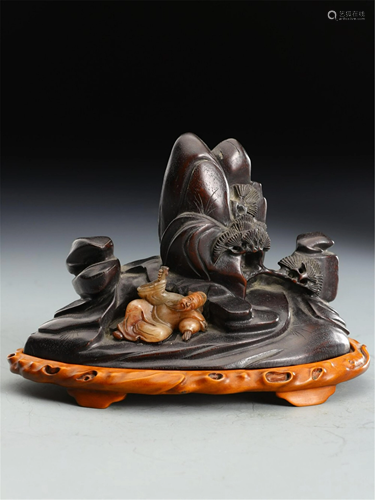 A SOAPSTONE FIGURAL CARVING & HARDWOOD DECORATI…