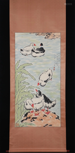 A CHINESE PAINTING OF GEESE IN THE POND