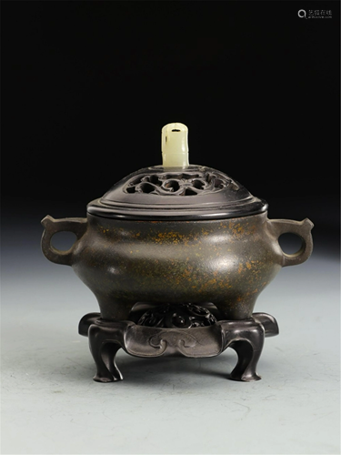 A BRONZE TRIPOD INCENSE BURNER WITH DOUBLE HANDLES