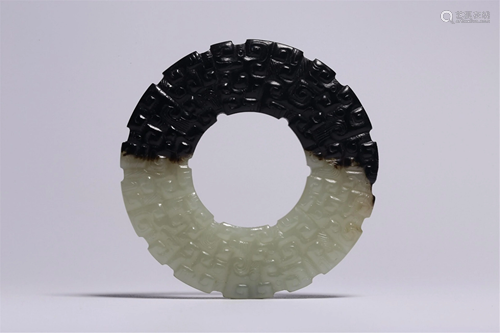 A CIRCULAR JADE DECORATION