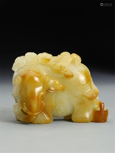 A WHITE JADE CARVING OF ELEPHANT AND TWO BOYS