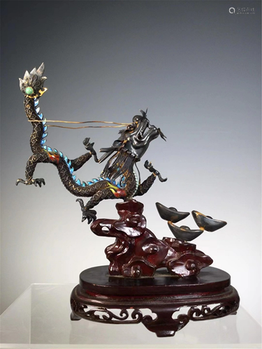 A GILT SILVER INLAID DRAGON AND INGOTS DECORATION