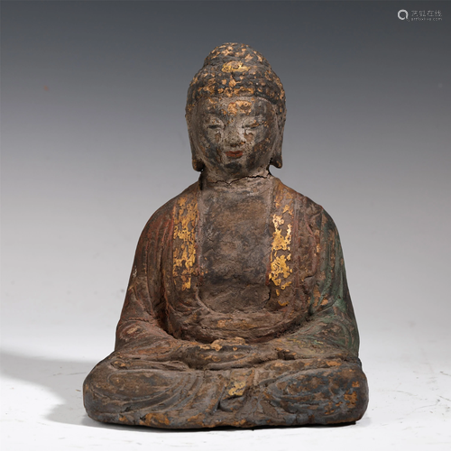 A WOODEN BUDDHA STATUETTE