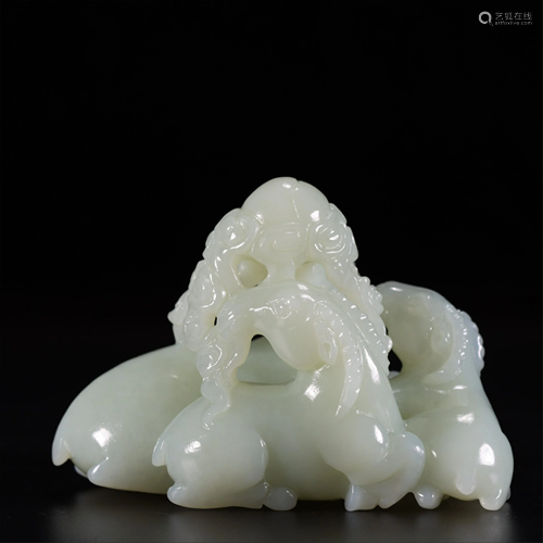 A JADE CARVED DECORATION OF THREE GOATS