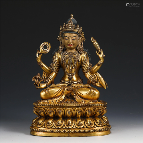 A GILT BRONZE FOUR-ARMED AVALOKITESVARA