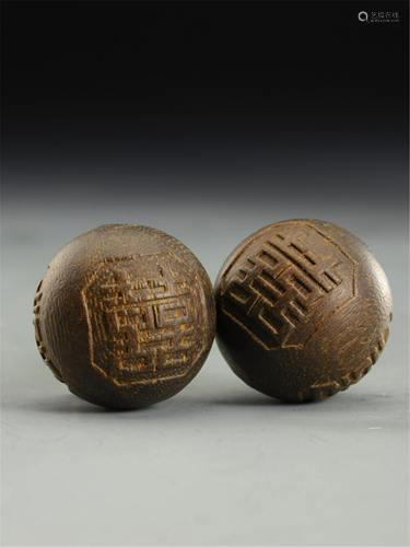 PAIR OF CARVED DOUBLE 'XI' CHARACTERS CHENGXIANG BALLS