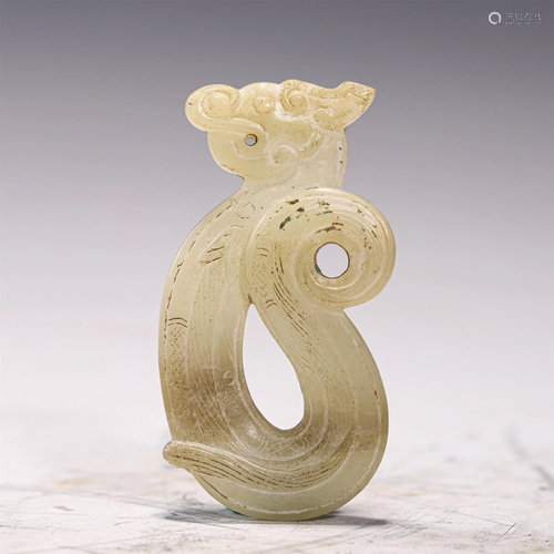 A JADE CARVED DRAGON PENDANT