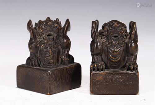 PAIR OF CHENXIANG WOOD CARVED BEAST SEALS