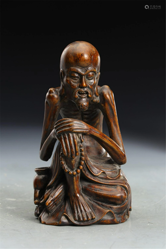 A CHENXIANG WOOD CARVED SEATED ARHAT