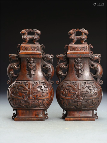 PAIR OF CARVED BEAST-FACE CHENGXIANG WOOD VASES