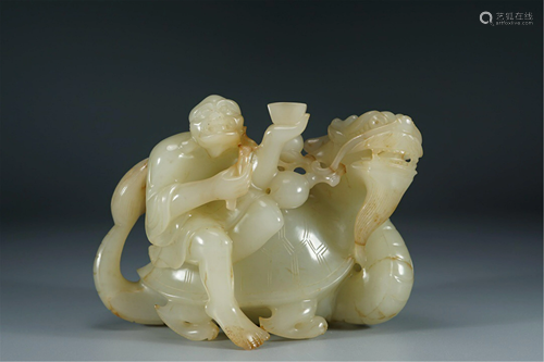 A WHITE JADE CARVING OF ARHAT AND DRAGON-TURTLE