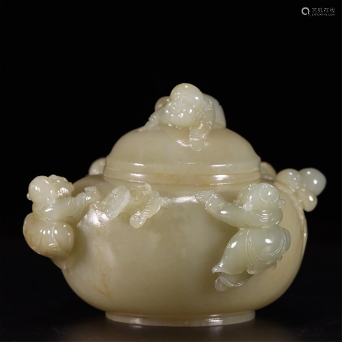 A JADE INCENSE BURNER WITH CHILD SHAPE HANDLES