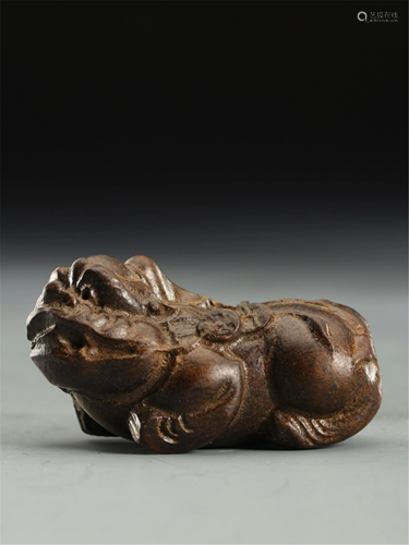 A CHENXIANG WOOD CARVED MYTHICAL BEAST