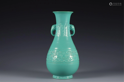 A TURQUOISE GREEN GLAZE VASE WITH ELEPHANT HANDLES