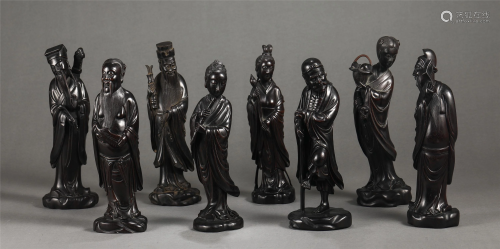 A SET OF HARDWOOD CARVED EIGHT IMMORTALS FIGURINES