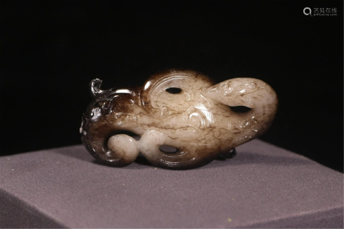 A MYTHICAL BEAST SHAPED JADE CARVING