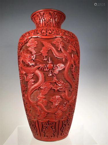 A CARVED RED LACQUER DRAGON VASE