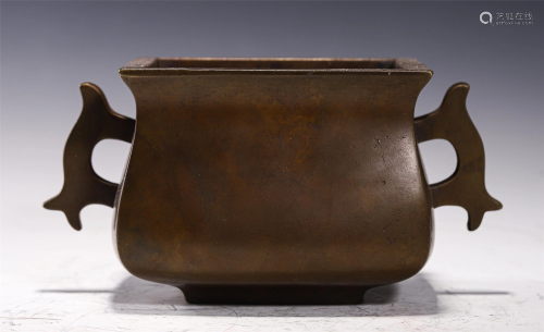 A BRONZE INCENSE BURNER WITH DOUBLE HANDLES