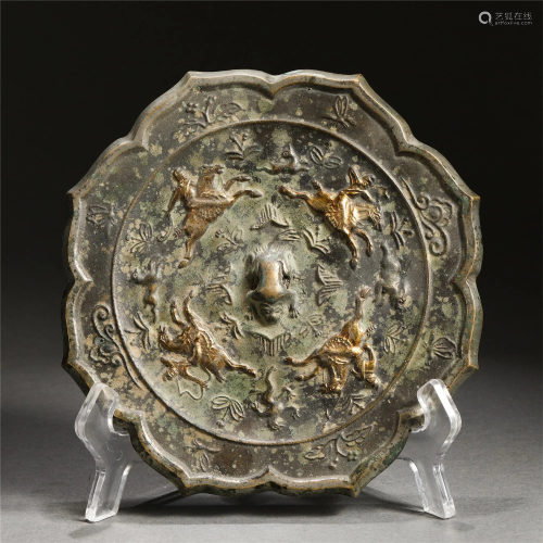 AN INCISED 'FIGURE ON HORSE' GILT BRONZE MIRROR