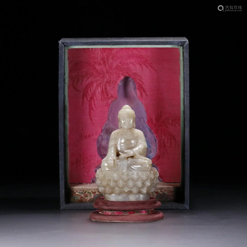 A JADE CARVED SEATED SAKYAMUNI