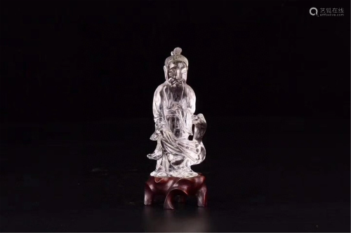 A CRYSTAL CARVED STANDING FIGURINE