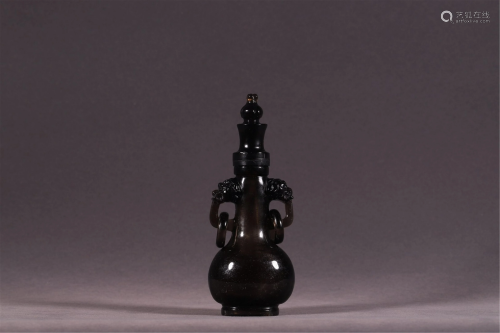 A CRYSTAL CARVED VASE WITH DOUBLE HANDLES