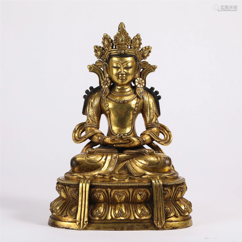 A GILT BRONZE SEATED AVALOKITESVARA