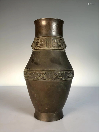 A CARVED BEASTS BRONZE VASE WITH DOUBLE HANDLES