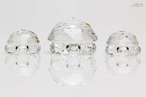 A Swarovski Crystal large Turtle together with two small Tur...