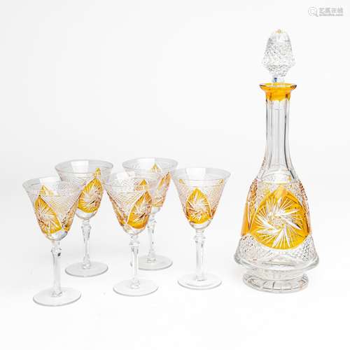 A Bohemian amber cut crystal decanter with five glasses. (6)...