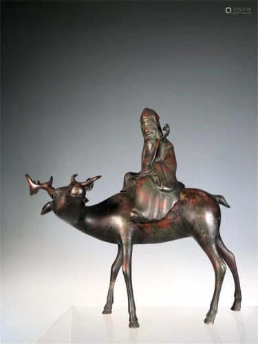 A BRONZE 'OLD MAN ON DEER' TABLE INCENSE BURNER