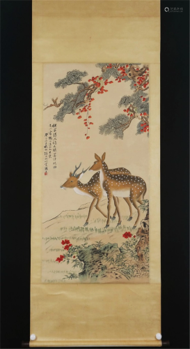 A CHINESE PAINTING OF PINE AND DEER