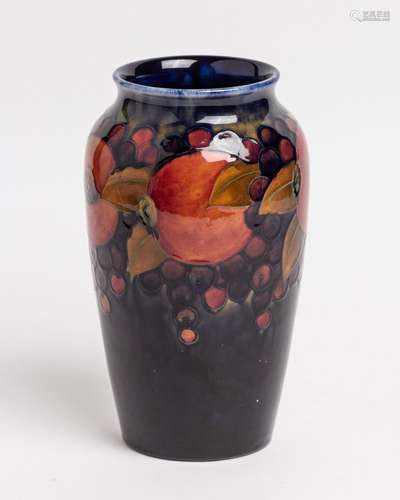 A Moorcroft Pomegranate pattern vase, 10 1/2 x 5 3/4 in. (26...