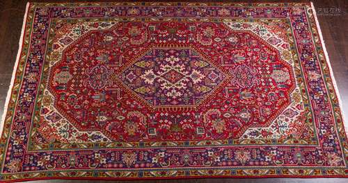 A Persian hand knotted wool area rug, 6'6" x 9...