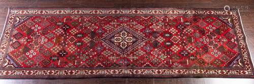 A Joshgan hand knotted wool runner, 4'11" x 12...