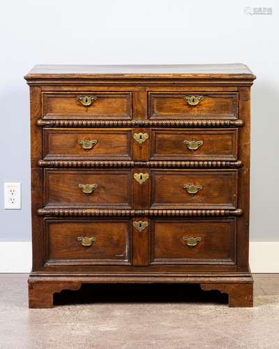 An early 18th century oak chest of two short and three long ...