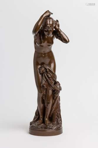 A patinated bronze figure of a lady bathing. 20 in. (51 cm)