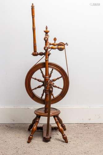 An antique spinning wheel.