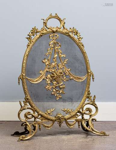 A neo-classical brass and wire mesh fire screen, 32 in. (81 ...