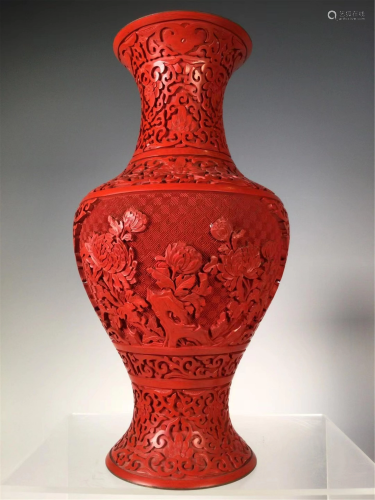 A CARVED RED LACQUER FLORAL VASE