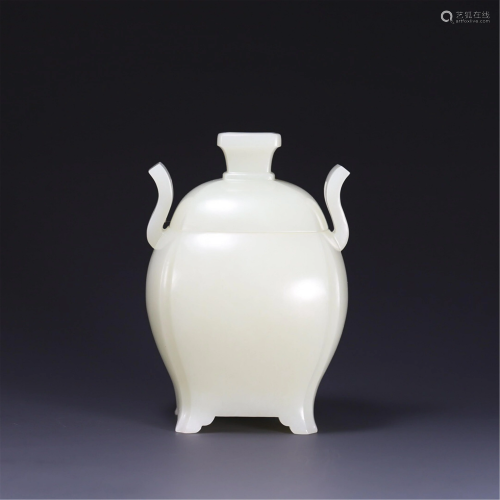 A CARVED JADE DOUBLE-HANDLED VASE AND COVER