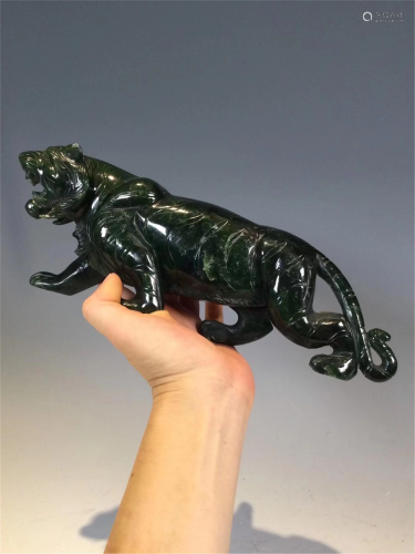 A CARVED JASPER DECORATING TIGER