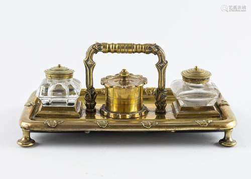 A brass double inkwell, 3 1/2 x 8 3/4 x 5 1/4 in. (9 x 22.3 ...