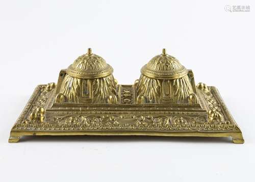 A heavily embossed brass double inkwell, 3 1/2 x 9 1/2 x 6 1...