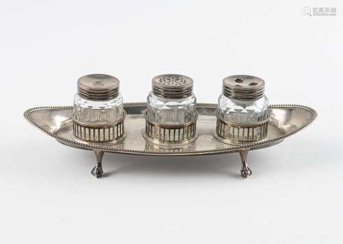 London 1882, a sterling silver and cut glass three bottle in...